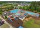 A community pool and playground with a splash pad, lounge chairs and tables has everything for outdoor fun at 3529 Bailey Lake Dr, Fuquay Varina, NC 27526