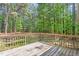 A wooden back deck overlooking a scenic wooded area at 3607 Springhollow Ct, Efland, NC 27243