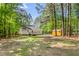 Large backyard with a shed, deck, and play area at 3607 Springhollow Ct, Efland, NC 27243
