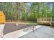 Backyard with a patio, shed, deck and wooded area at 3607 Springhollow Ct, Efland, NC 27243