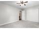 This bedroom features neutral walls, carpet, and a ceiling fan at 3607 Springhollow Ct, Efland, NC 27243