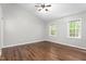 Spacious bedroom featuring hardwood floors, natural light and a ceiling fan at 3607 Springhollow Ct, Efland, NC 27243