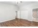 Light filled bedroom with hardwood flooring and view to on-suite bathroom at 3607 Springhollow Ct, Efland, NC 27243