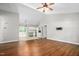 Spacious living area featuring hardwood floors flowing into an open kitchen at 3607 Springhollow Ct, Efland, NC 27243