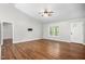 Bright living area with hardwood floors and views of the entry door and front yard at 3607 Springhollow Ct, Efland, NC 27243