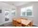 Bright dining area adjacent to the kitchen with a view to the patio at 361 Natsam Woods Way, Wake Forest, NC 27587