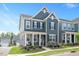 Charming two-story home with a welcoming front porch and manicured landscaping at 361 Natsam Woods Way, Wake Forest, NC 27587