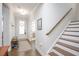 Bright foyer with hardwood floors, staircase, and ample natural light at 361 Natsam Woods Way, Wake Forest, NC 27587
