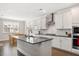 Modern kitchen featuring stainless steel appliances, large island, and white cabinetry at 361 Natsam Woods Way, Wake Forest, NC 27587