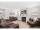 Comfortable living room features a fireplace, plush seating, and bright windows at 361 Natsam Woods Way, Wake Forest, NC 27587