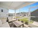 Relaxing screened porch with comfortable seating, perfect for enjoying the outdoors at 361 Natsam Woods Way, Wake Forest, NC 27587