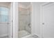 Modern walk-in shower with glass door and tile surround at 361 Natsam Woods Way, Wake Forest, NC 27587