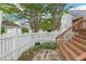 Cozy backyard area with a white picket fence and a small garden at 403 Brookgreen Dr, Chapel Hill, NC 27516