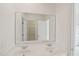 Bathroom featuring a double sink vanity and a large mirror with access to the shower and bedroom at 403 Brookgreen Dr, Chapel Hill, NC 27516