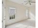 Neutral bedroom with bright windows and a closet with golden knobs at 403 Brookgreen Dr, Chapel Hill, NC 27516
