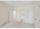 Neutral bedroom with access to bath and closet with a carpeted floor at 403 Brookgreen Dr, Chapel Hill, NC 27516