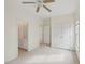Neutral bedroom with access to bath and closet with a carpeted floor at 403 Brookgreen Dr, Chapel Hill, NC 27516
