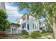 Charming two-story home with white siding, a blue front door, and a delightful garden entrance at 403 Brookgreen Dr, Chapel Hill, NC 27516