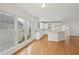 Bright eat-in kitchen with hardwood floors and natural light from nearby windows at 403 Brookgreen Dr, Chapel Hill, NC 27516