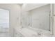 Main bathroom features a dual sink vanity with large mirrors and a view of the bedroom at 403 Brookgreen Dr, Chapel Hill, NC 27516