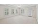 Airy main bedroom offers great natural light through multiple windows and features shuttered windows at 403 Brookgreen Dr, Chapel Hill, NC 27516