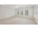 Spacious main bedroom with trey ceilings, fan, and large shuttered windows at 403 Brookgreen Dr, Chapel Hill, NC 27516