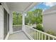 Inviting porch overlooking the street with mature trees and fresh air at 403 Brookgreen Dr, Chapel Hill, NC 27516