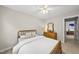 Bedroom with neutral walls, ceiling fan, carpeted floor, dresser and large window at 408 Evert Dr, Cary, NC 27511