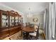 Formal dining room featuring a chandelier, large china cabinet, and elegant decor at 408 Evert Dr, Cary, NC 27511