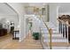 Elegant foyer with a staircase, hardwood floors, and neutral wall paint providing a bright and inviting atmosphere at 408 Evert Dr, Cary, NC 27511