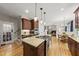 Open kitchen with granite countertops, stainless steel appliances and an eat-in dining area at 408 Evert Dr, Cary, NC 27511