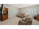 Relaxing living room featuring comfortable seating and a built-in display case at 408 Evert Dr, Cary, NC 27511