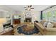 Comfortable living room with a brick fireplace, hardwood floors, and plenty of natural light at 408 Evert Dr, Cary, NC 27511
