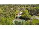 Aerial view of community amenities including a pool, tennis court, and lush landscaping at 4101 John S Raboteau Wynd, Raleigh, NC 27612