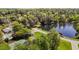 Community lake with a fountain feature, tennis court, and lush landscaping at 4101 John S Raboteau Wynd, Raleigh, NC 27612