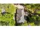 Aerial view of a stunning home featuring lush landscaping, inviting outdoor space, and a pristine driveway at 4101 John S Raboteau Wynd, Raleigh, NC 27612