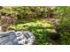 A well-manicured backyard provides a serene escape, complete with a lovely patio and lush greenery at 4101 John S Raboteau Wynd, Raleigh, NC 27612