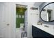 Bright and cheerful bathroom with green accent wall and fun nautical decor at 4101 John S Raboteau Wynd, Raleigh, NC 27612