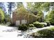 Traditional brick home with a two-car garage and mature trees at 4101 John S Raboteau Wynd, Raleigh, NC 27612