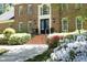 Inviting brick home with a black front door, steps, rod iron railing and landscaping at 4101 John S Raboteau Wynd, Raleigh, NC 27612