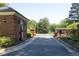 View of the community gate, featuring a brick guardhouse and a secure gated entrance at 4101 John S Raboteau Wynd, Raleigh, NC 27612