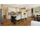 Spacious kitchen with an island, granite countertops, and white cabinetry at 4101 John S Raboteau Wynd, Raleigh, NC 27612
