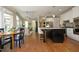 Open-concept kitchen featuring a large island, stainless steel appliances, and a breakfast nook at 4101 John S Raboteau Wynd, Raleigh, NC 27612
