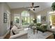 Inviting living room with high ceilings, large windows, and comfortable seating at 4101 John S Raboteau Wynd, Raleigh, NC 27612