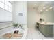 Bright bathroom features a soaking tub, vanity, and tile flooring at 4101 John S Raboteau Wynd, Raleigh, NC 27612