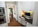 Built-in office nook with custom cabinetry and ample storage space off the kitchen at 4101 John S Raboteau Wynd, Raleigh, NC 27612