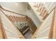 View down staircase to grand piano and gallery wall at 4101 John S Raboteau Wynd, Raleigh, NC 27612