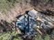 Aerial view of a large home nestled on a wooded lot with a pool, guest house, and circular driveway at 464 Rosemont Dr, Durham, NC 27713