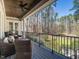 Back porch offers comfortable seating and a scenic view of the lush green yard and surrounding trees at 464 Rosemont Dr, Durham, NC 27713