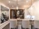 Chic bar area features a marble countertop, pendant lighting, and a glass-enclosed wine cellar at 464 Rosemont Dr, Durham, NC 27713